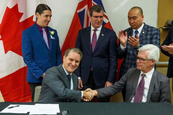 MIKE DEAL / WINNIPEG FREE Press FilesThe federal government announced nearly $4.2 million in funding to increase access to substance-abuse treatment in Manitoba last week. Provincial Health Minister Cameron Friesen (front left) and federal International Trade Diversification Minister Jim Carr shake hands after Friesen finalized the agreement with his signature while (from back left) Winnipeg Centre MP Robert-Falcon Ouellette, Brandon West MLA Reg Helwer and St. Norbert MLA Jon Reyes watch at the Crisis Response Centre at the Health Sciences Centre.