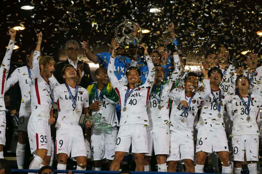 Vahid Salemi / The Associated Press Files
Mitsuo Ogasawara (centre) and the Kashima Antlers celebrate after winning the AFC Champions League against Iran in November.