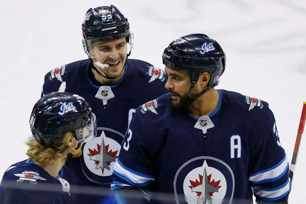 JOHN WOODS / WINNIPEG FREE PRESS
Jets' Kyle Connor (81), Mark Scheifele (55) and Dustin Byfuglien (33) celebrate Byfuglien's goal against the Philadelphia Flyers during second period NHL action in Winnipeg on Sunday.