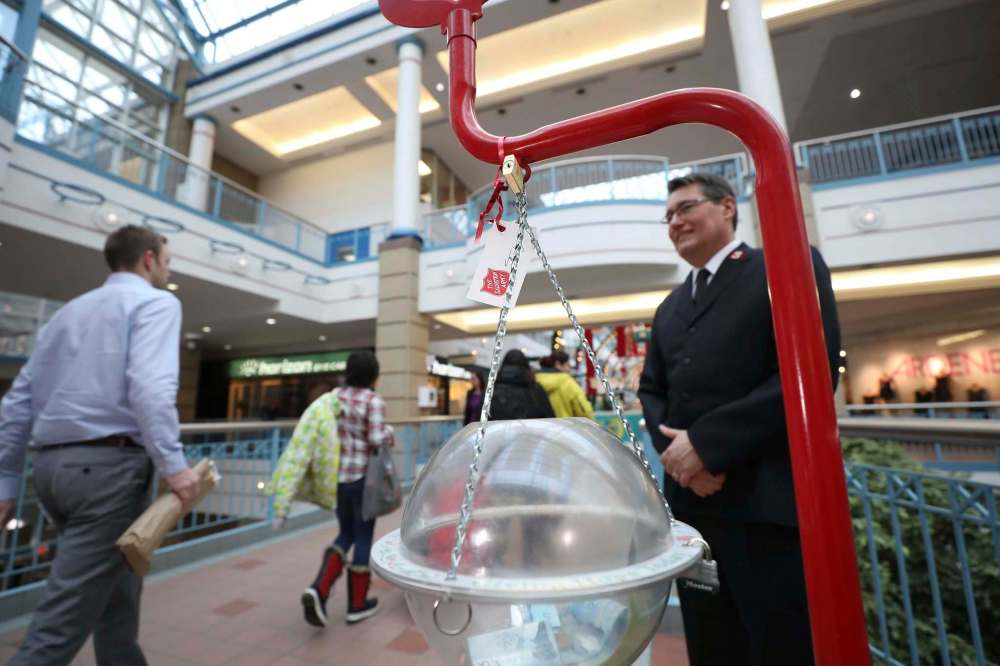RUTH BONNEVILLE / WINNIPEG FREE PRESS
Local Salvation Army Christmas Kettle
Rob Kerr, Salvation Army Public Relations secretary at Kettle at Portage Place Shopping Centre.
Photos of Kerr with Kettle and kettle by itself with mall patrons in background.
See story by Danton Unger.
Dec 12th, 2018