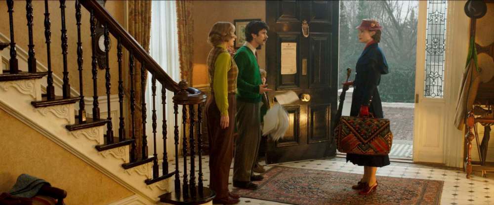 Emily Blunt (right) is Mary Poppins, who falls from out of the sky to again help the Banks family, Michael (Ben Whishaw, centre) and Jane (Emily Mortimer). (Disney)