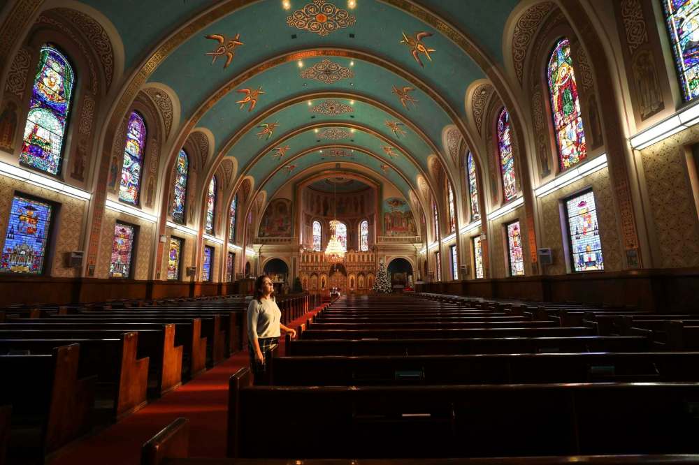 RUTH BONNEVILLE / WINNIPEG FREE PRESS
The parish’s secretary, Anna Katchanovski, says newcomers are often taken aback by the beauty of the cathedral’s sky-blue ceiling and majestic stained-glass windows.