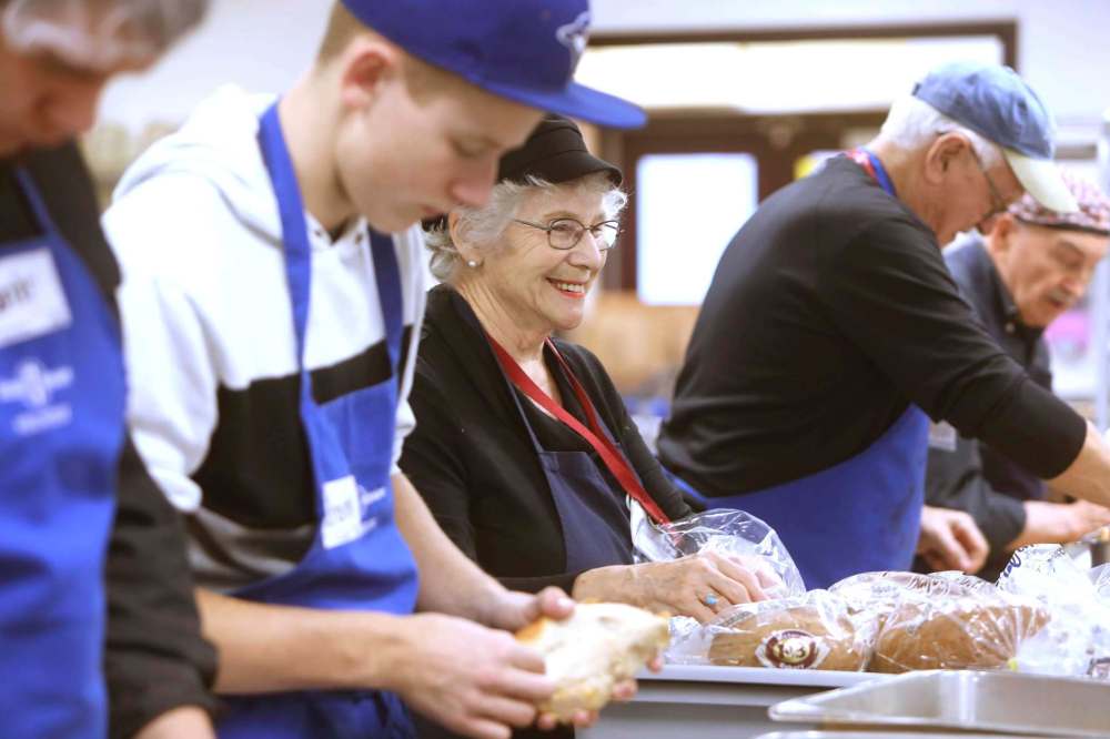 Carole Cockrell is all smiles as she helps with prep in the Siloam kitchen.