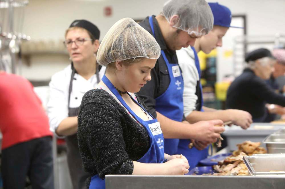 Volunteers working the prep line at Siloam Mission.