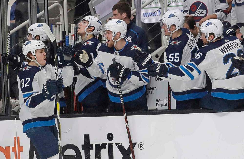 (AP Photo/Jeff Chiu)
Winnipeg Jets centre Mason Appleton is congratulated by teammates after scoring a goal against the San Jose Sharks during the first period in San Jose, Calif., Thursday.