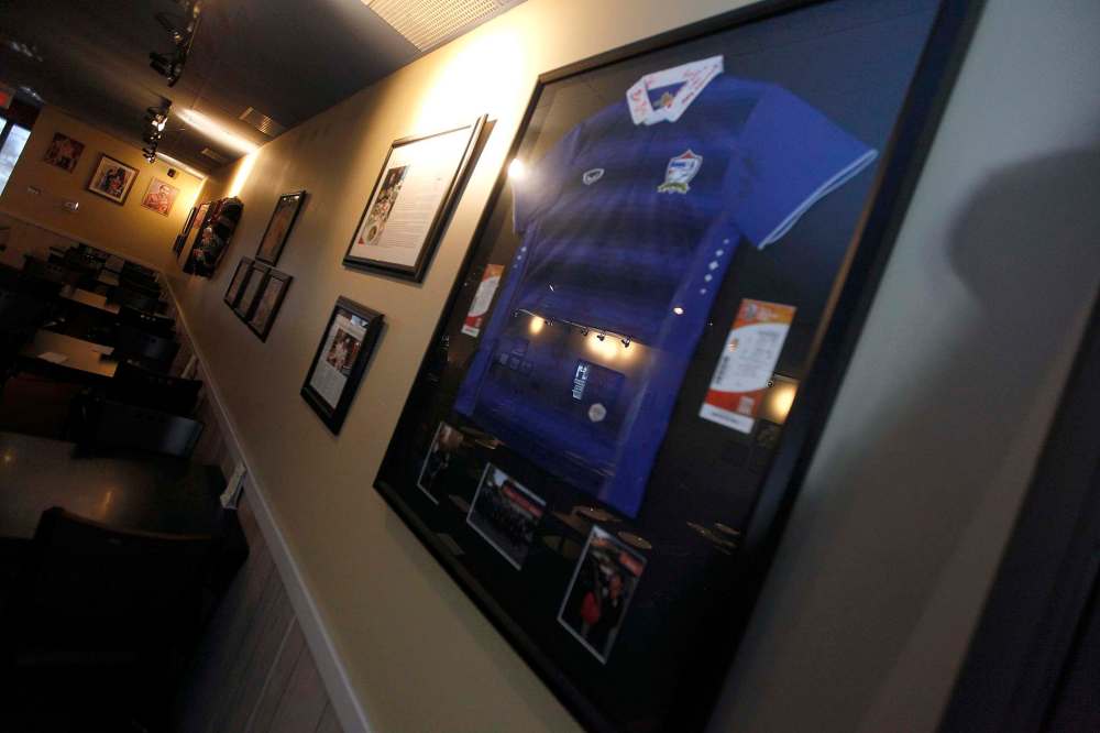 A jersey signed by members of the Thai national women’s soccer team hangs on the wall at Siam Thai.