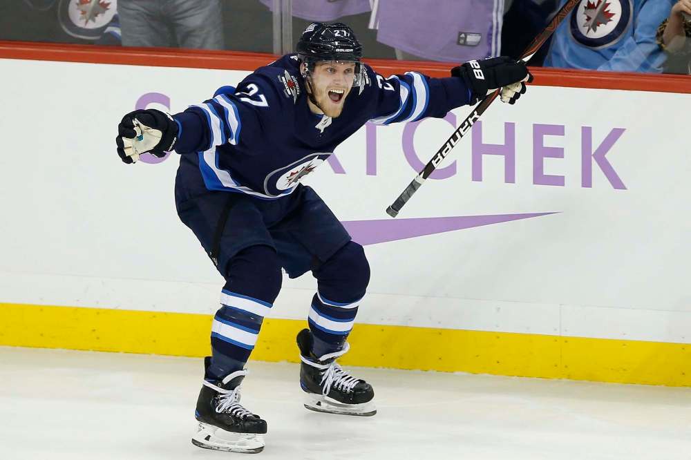 JOHN WOODS / THE CANADIAN PRESS FILES <p />
Nikolaj Ehlers has been on fire of late, seen here celebrating a hat trick against the Chicago Blackhawks Nov. 29, a trick he'd repeat on the road against the San Jose Sharks Dec. 20.