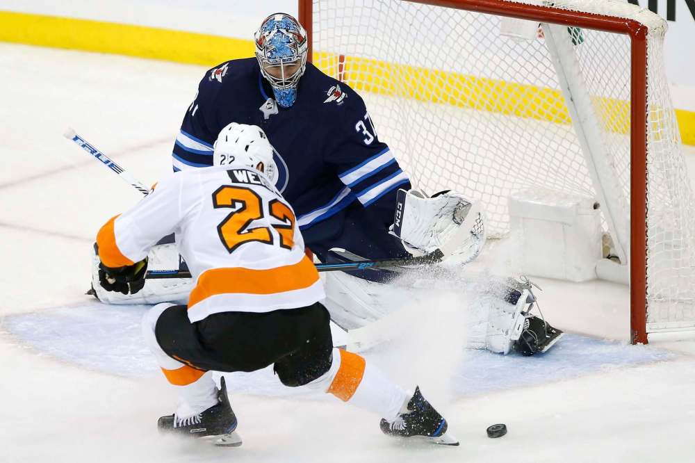 Connor Hellebuyck says players aren't afraid around goalies anymore. (John Woods / Winnipeg Free Press files)