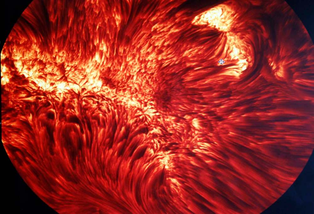 Allen J. Schaben / Los Angeles Times Files
Images of sunspots are displayed at Big Bear Solar Observatory, in Big Bear, Calif. While the surface of the sun can appear to be aflame, the sun doesn't 'burn' in a conventional sense.