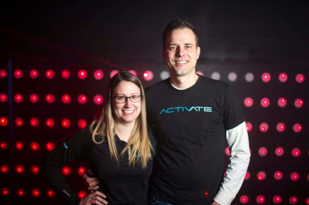 Megan and Adam Schmidt are ready to give Winnipeggers a new indoor gaming experience at Activate Games. (Mikaela MacKenzie / Winnipeg Free Press)