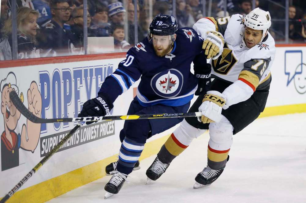JOHN WOODS / WINNIPEG FREE PRESS files
Jets veteran defenceman Joe Morrow, left, is making the most of increased playing time. He scored a goal and added an assist in his most recent game Tuesday.