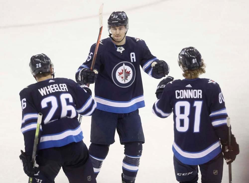 THE CANADIAN PRESS/Trevor Hagan
Winnipeg Jets' Kyle Connor, right, is making the most of his time playing on the team's top line with Blake Wheeler, left and Mark Scheifele, centre.