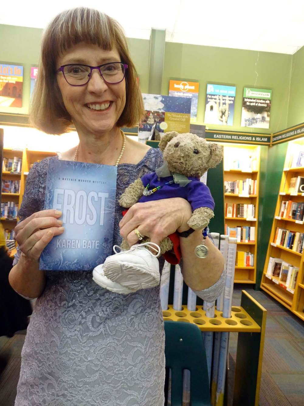 Author Karen Bate shows off her newest book, Frost. Quigley, her bear, joined her.