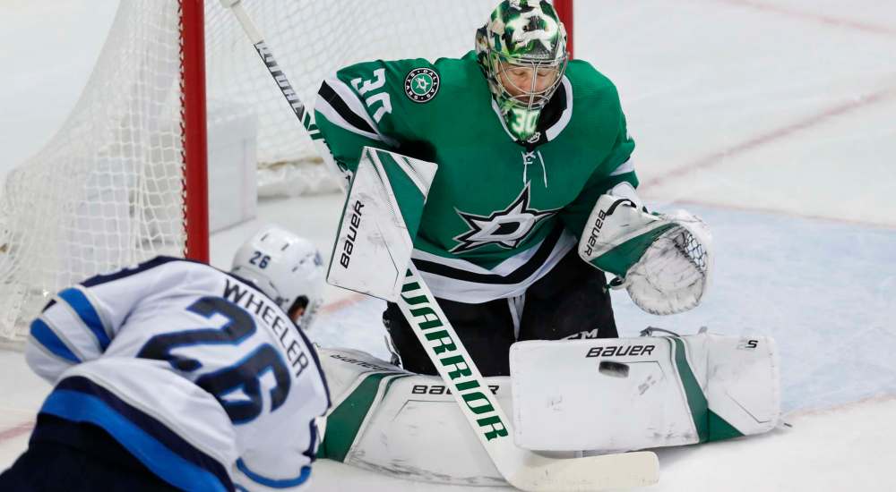 LM Otero / The Associated Press
Dallas Stars goaltender Ben Bishop stops a shot against Winnipeg Jets captain Blake Wheeler during an NHL hockey game in Dallas on Saturday.