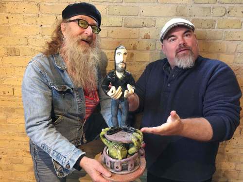 photos SUPPLIED
Artist Jordan Van Sewell (left) and comedian Big Daddy Tazz show off Van Sewell&rsquo;s Darcy Oake sculpture that will be auctioned off.