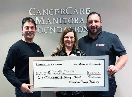 photos Supplied
Frank Cicco (left) and Derek Roth (right), the owners of Adventure Power Products in Île-des-Chênes, recently presented Kerri Johnson of Cancer Care Manitoba Foundation with a cheque for more than $6,000.