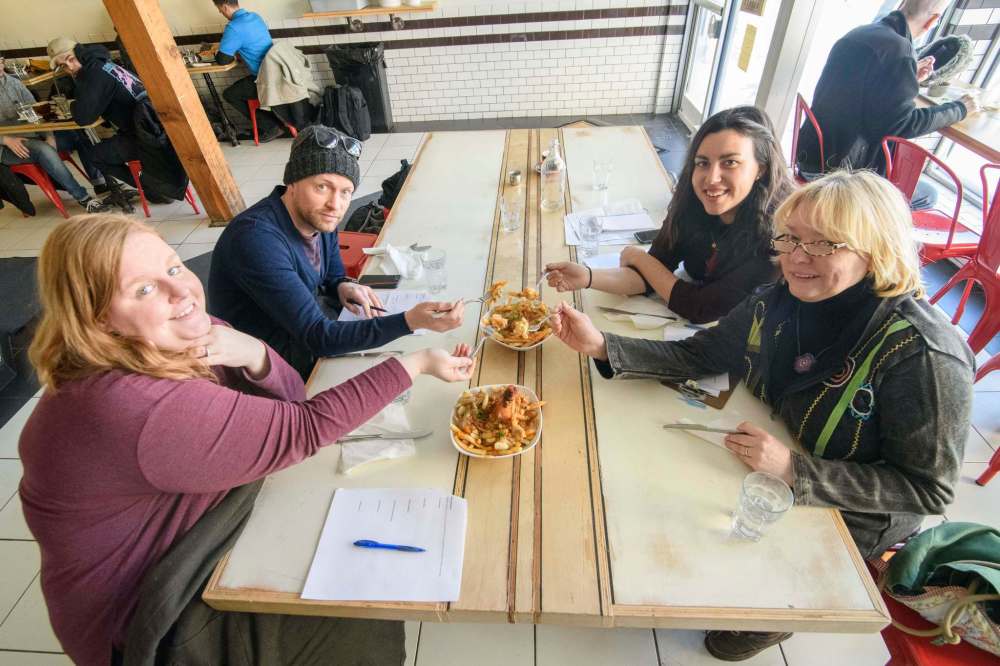 Mike Sudoma / Winnipeg Free Press
Winnipeg Free Press writers (from left) Erin Lebar, Ben MacPhee-Sigurdson, Jessica Botelho-Urbanski and Wendy King dig into poutine at Miss Browns, one of their many poutine stops.