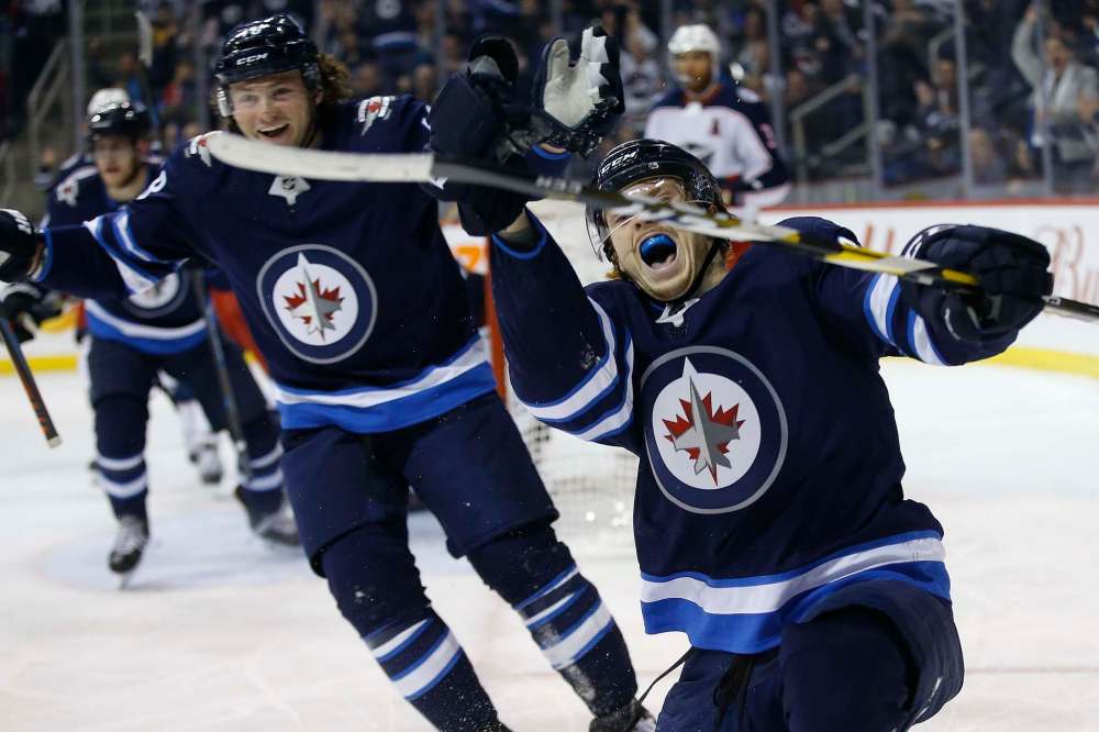 John Woods / The Canadian Press
Winnipeg Jets' Mason Appleton (right) and Brendan Lemieux celebrate Appleton's goal against the Columbus Blue Jackets.