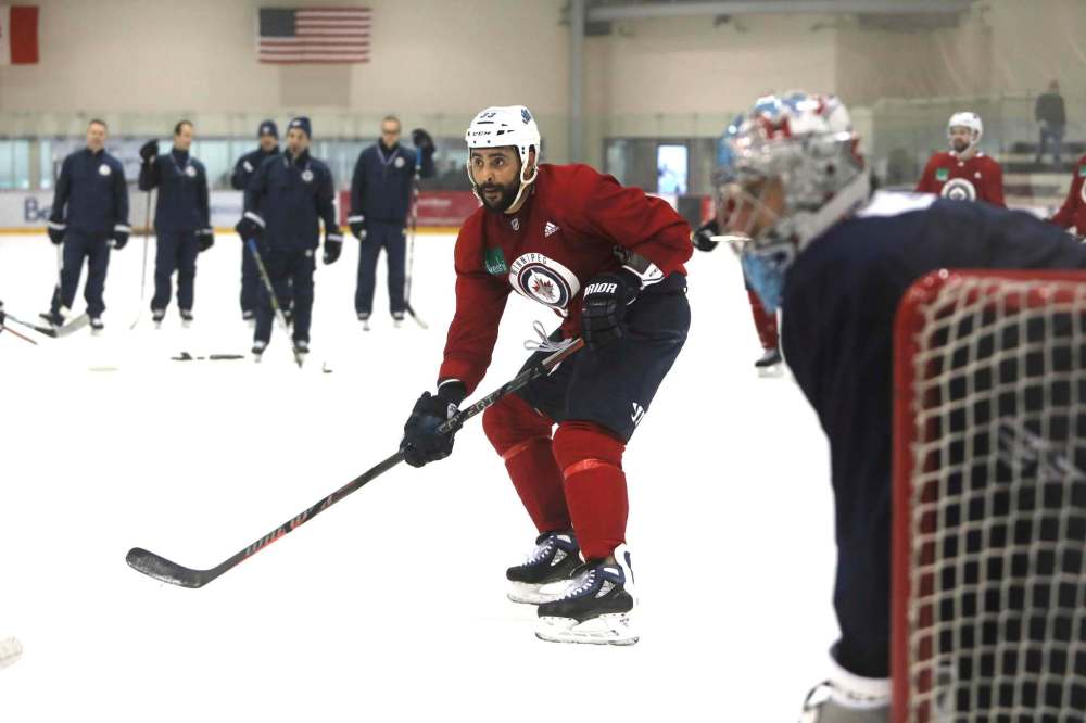 Dustin Byfuglien has been participating in full workouts this week, but coach Paul Maurice wants to give him a little more recovery time. (Ruth Bonneville / Winnipeg Free Press)
