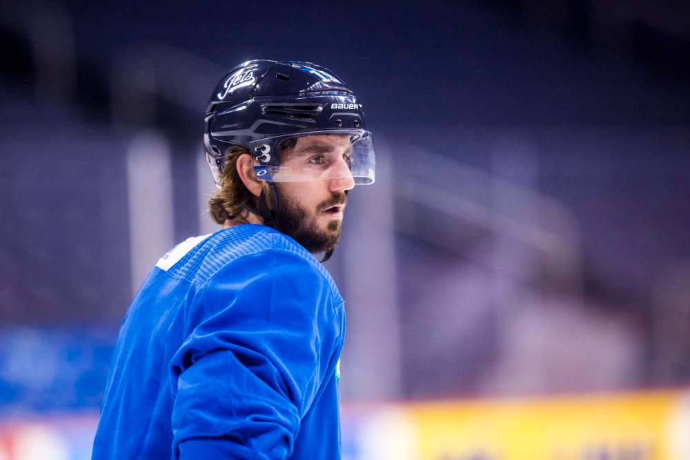 MIKAELA MACKENZIE / WINNIPEG FREE PRESS FILES
Nic Petan took part in the pre-game warm-up for a second straight game Tuesday, only to be sent to the press box as a healthy scratch for the 17th straight game.