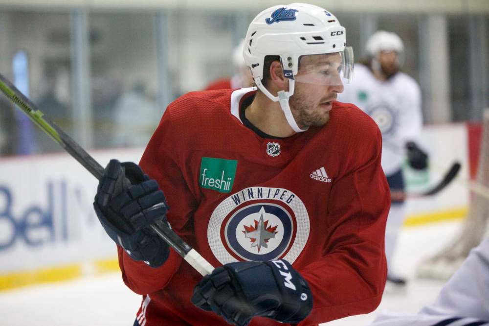 MIKE DEAL / WINNIPEG FREE PRESS FILES
Tucker Poolman missed 17 games while recovering from a concussion/whiplash sustained in a collision during a Nov. 23 against the Iowa Wild.