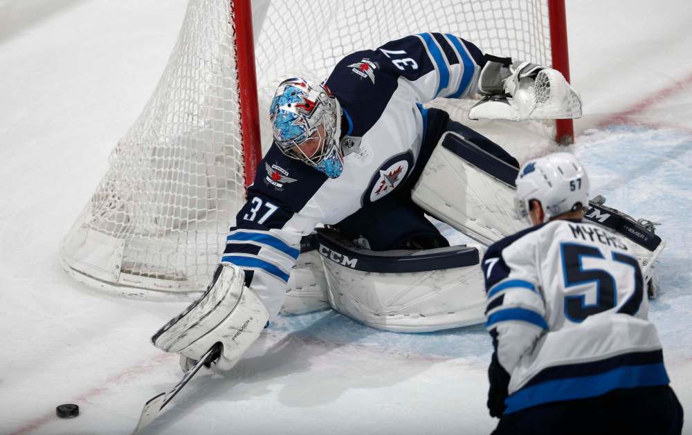 Goalie Connor Hellebuyck was completely thrown to the wolves by his teammates and smashed his stick in half.
