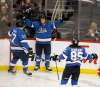 Brandon Tanev celebrates a goal with Adam Lowry and Mathieu Perreault against the Detroit Red Wings last month. Recently the Jets’ third line has gone a little cold. (Phil Hossack / Free Press files)