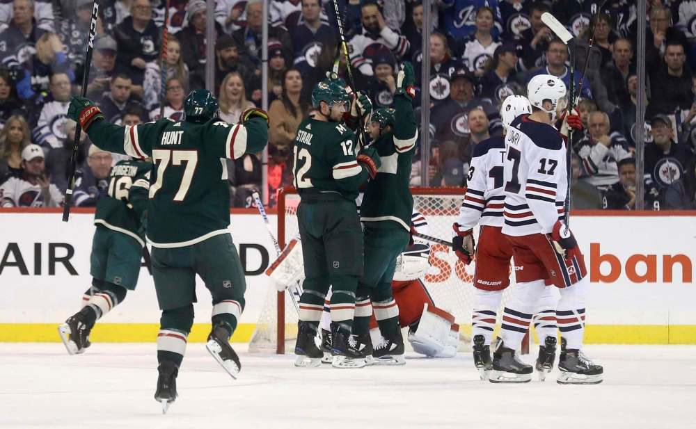 Minnesota's Brad Hunt celebrates the Wild's first goal of the night, which was the team's only goal until the final 90 seconds of the game. (Trevor Hagan / The Canadian Press)