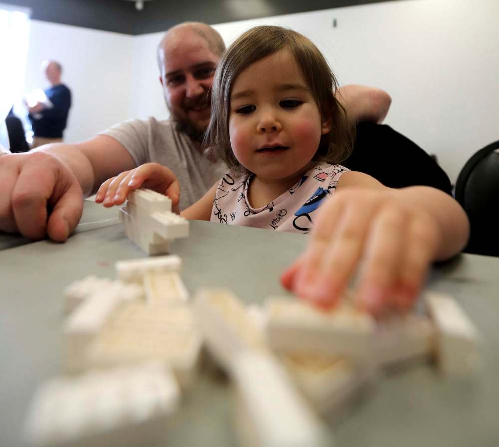 Billy Martens and daughter Shirley, 2, share some quality Lego-time.