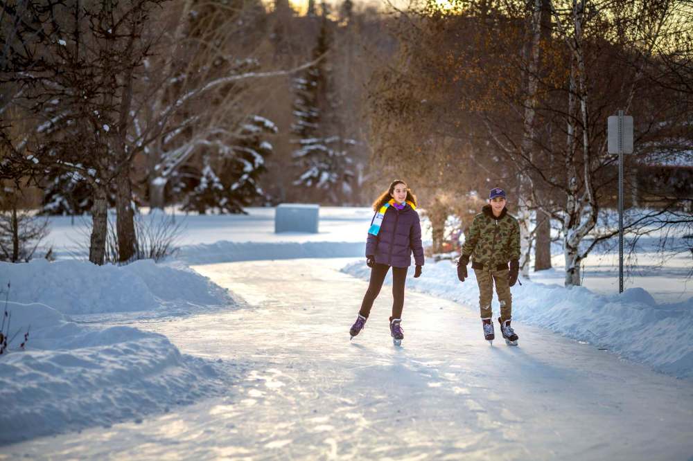 Young Edmontonians skate a trail in one of the river valley parks. (Laughing Dog Photography / City of Edmonton)
