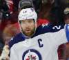 Gerry Broome / The Associated Press
Winnipeg Jets' Blake Wheeler (26) and Mark Scheifele celebrate following Wheeler's goal while Carolina Hurricanes' Dougie Hamilton (19) and Jaccob Slavin, right, skate away during the first period of an NHL hockey game in Raleigh, N.C., Friday, March 8, 2019.