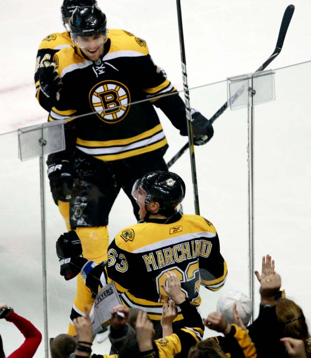 (AP Photo/Charles Krupa)
Both Boston Bruins in 2011, Marchand, bottom, and Wheeler, top, have been adversaries longer than they were teammates.