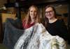 Tessa Whitecloud (left), executive director of 1JustCity, and Laura Dahl with a blanket made from discarded plastic bags. (Ruth Bonneville / Winnipeg Free Press)