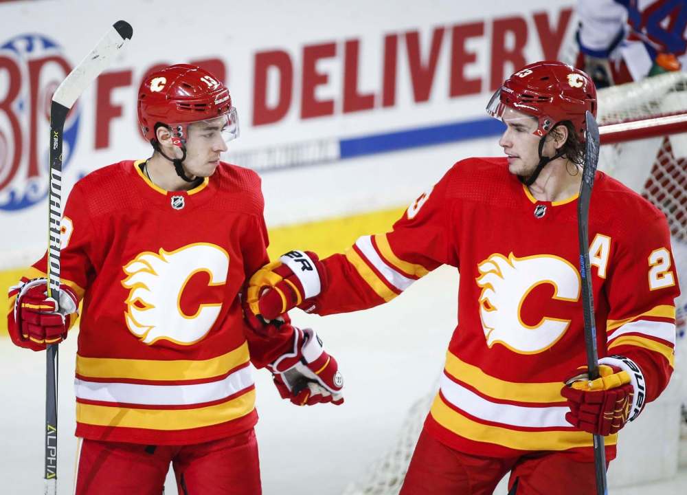 Johnny Gaudreau (left) and Sean Monahan lead the Flames in points this season with 91 and 76 respectively. Gaudreau had a six-point night Tuesday in New Jersey. (Jeff McIntosh / The Canadian Press files)