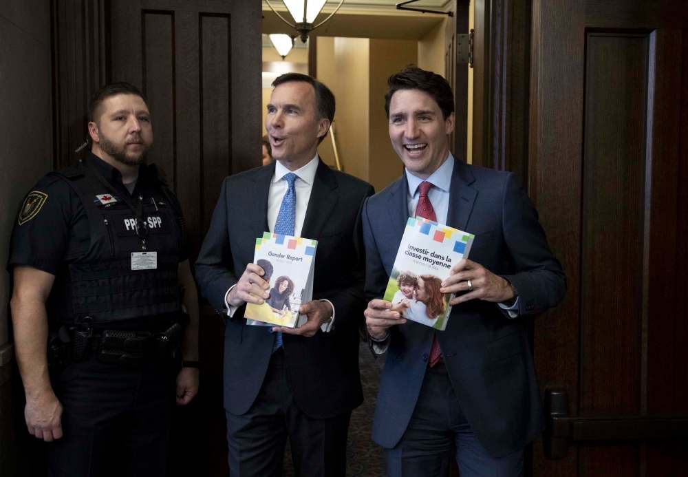 Prime Minister Justin Trudeau and Minister of Finance Bill Morneau arrive in the Foyer of the House of Commons to table the Budget, on Parliament Hill in Ottawa on Tuesday, March 19, 2019. (Justin Tang / The Canadian Press)