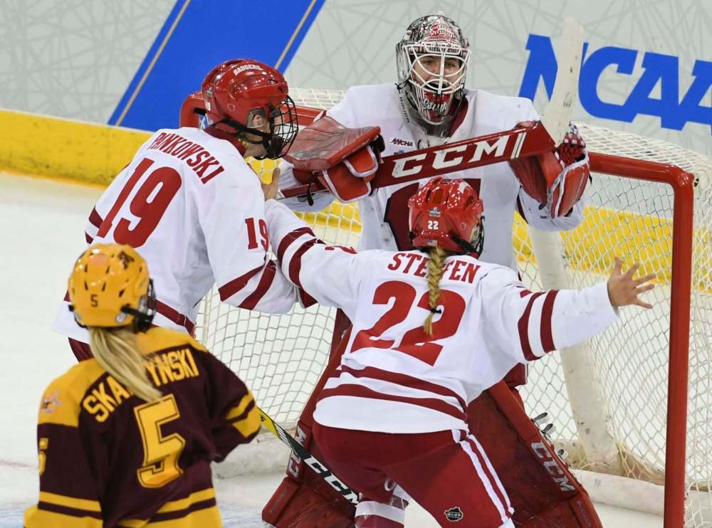 Stephen Dunn / The Associated Press
Wisconsin goaltender Kristen Campbell is greeted by teammates as they defeat Minnesota for the NCAA Division I women’s Frozen Four hockey championship game on Sunday.