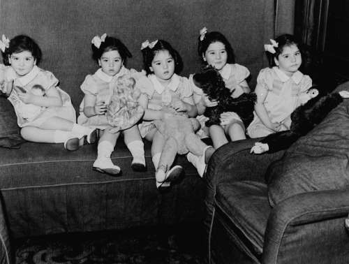 The Dionne quintuplets in their train car on a trip to Toronto in 1939. (National Archives of Canada)
