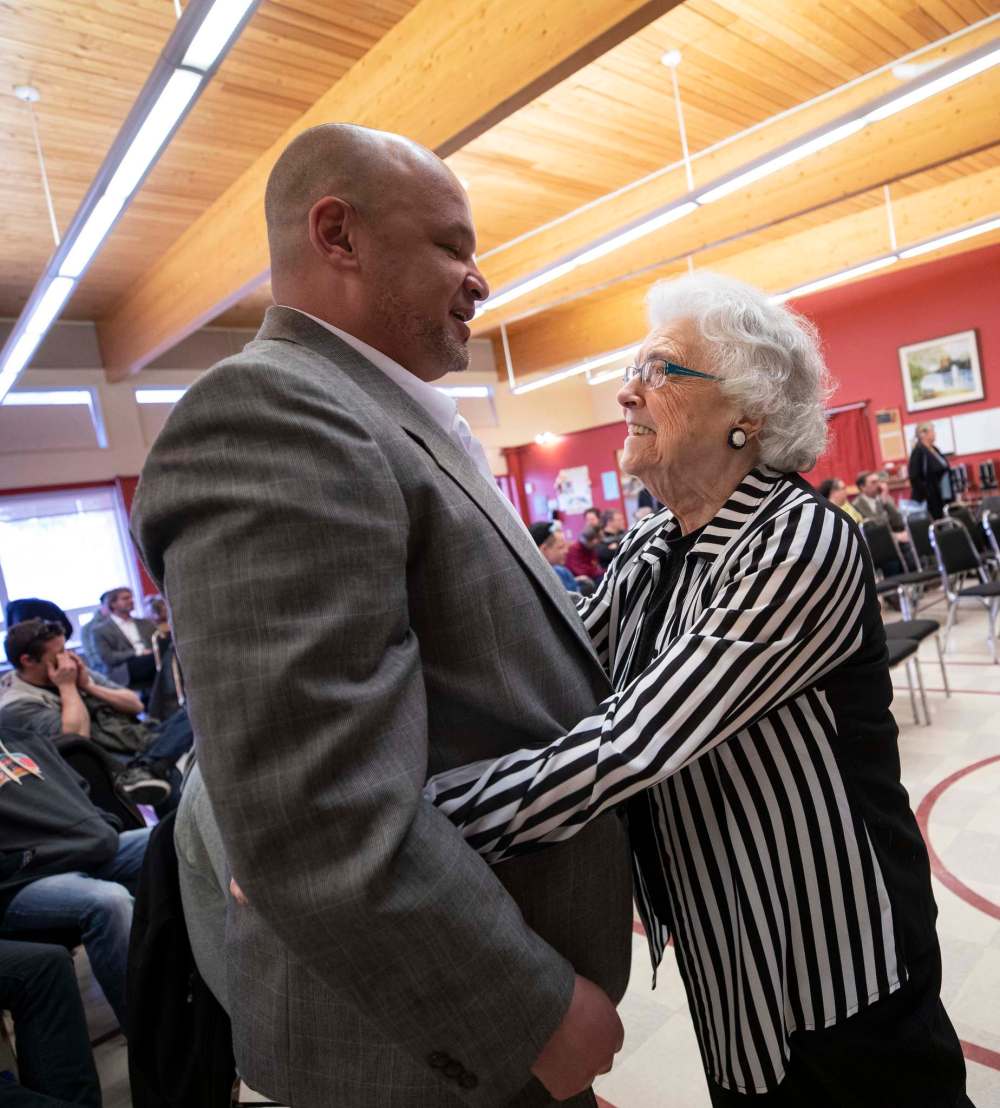 Christopher Hudlin gets a hug from “Mamma Bear” Sheila Clayden as he graduates from Simon House a centre that treats men’s addictions in Calgary, Alberta.