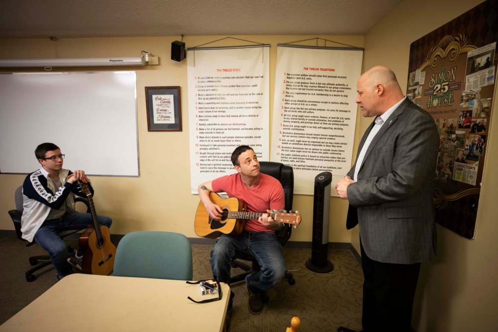 Simon House clients talk to Trevor Loria.