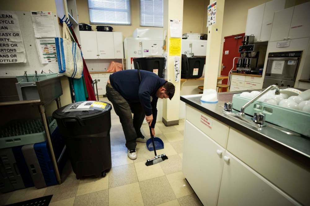 A client cleans the senior centre,