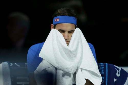 Tim Ireland / The Associated Press files
Tennis star Roger Federer wipes off with a towel during the World Tour Finals in November.