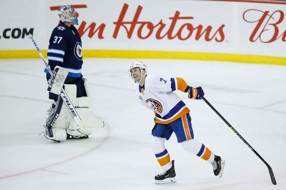 Jordan Eberle was all smiles after scoring the game-winning goal on Connor Hellebuyck with less than a minute left in Thursday's game. (John Woods / The Canadian Press)