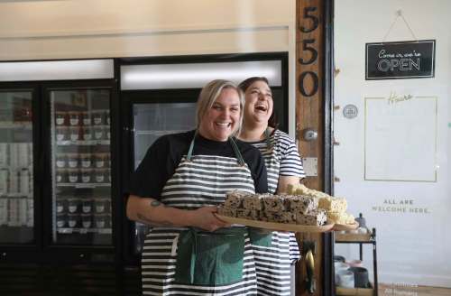 RUTH BONNEVILLE / WINNIPEG FREE PRESS
Black Market Provisions shop owners Angela Farkas (left) and Alana Fiks with their famous Rice Krispies squares in store. The general store opened its doors on March 21.