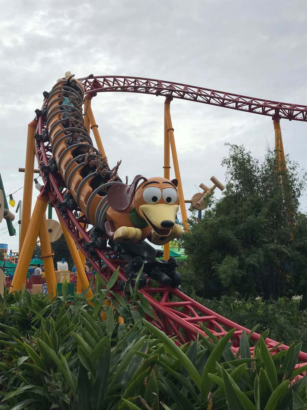 The Slinky Dog Dash roller-coaster has visitors twisting around curves and dropping down hills.