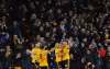 photos by Rui Vieira / The Associated Press
Wolverhampton Wolves players and fans celebrate their second goal during an EPL match against Manchester United at Molineux Stadium Tuesday. Diogo Jota (below) scored the opener.