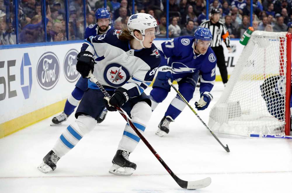 Sami Niku played some games with the Jets when they needed him, but with a healty defensive roster, he's a healthy scratch. (Chris O'Meara / The Associated Press files)