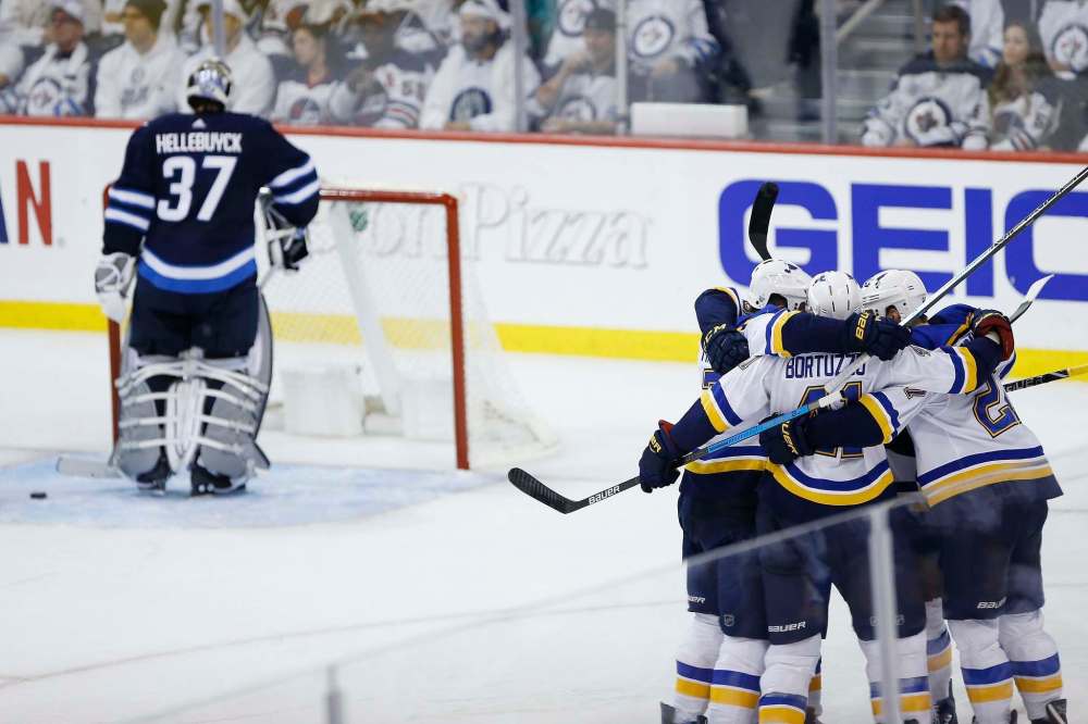 The St. Louis Blues celebrate Tyler Bozak's game-winning goal Wednesday during Game 1 of the best-of-seven playoff series. (John Woods / The Canadian Press)