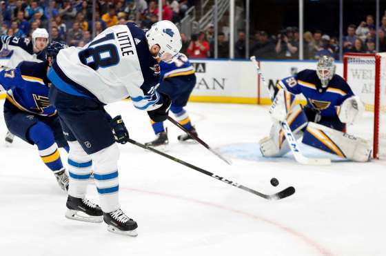 Jeff Roberson / The Associated PressWinnipeg Jets' Bryan Little (18) shoots toward St. Louis Blues goaltender Jordan Binnington during the first period in Game 6 on Saturday in St. Louis.