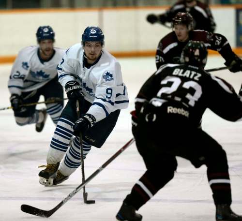 PHIL HOSSACK / WINNIPEG FREE PRESS
Chris Sass of the St. James Canucks looks for a way around Jordan Blatz of the Pembina Valley Twisters during Game 4 of the Manitoba Major Junior Hockey League championship series Thursday night at the St. James Civic Centre. The Canucks won 4-1 to even the series at two games apiece.