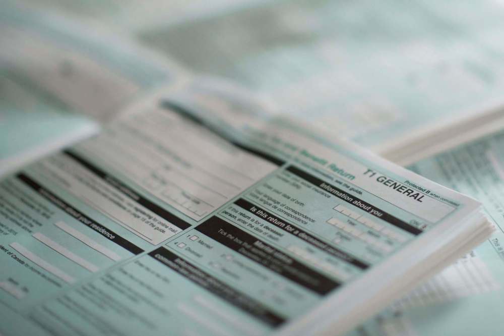 The T1 General tax form can be a daunting experience for some tax filers. An automated system, as used in some European countries, would ease the tax-filing burden and ensure those who need benefits and deductions most get them.
GRAEME ROY / THE CANADIAN PRESS FILES